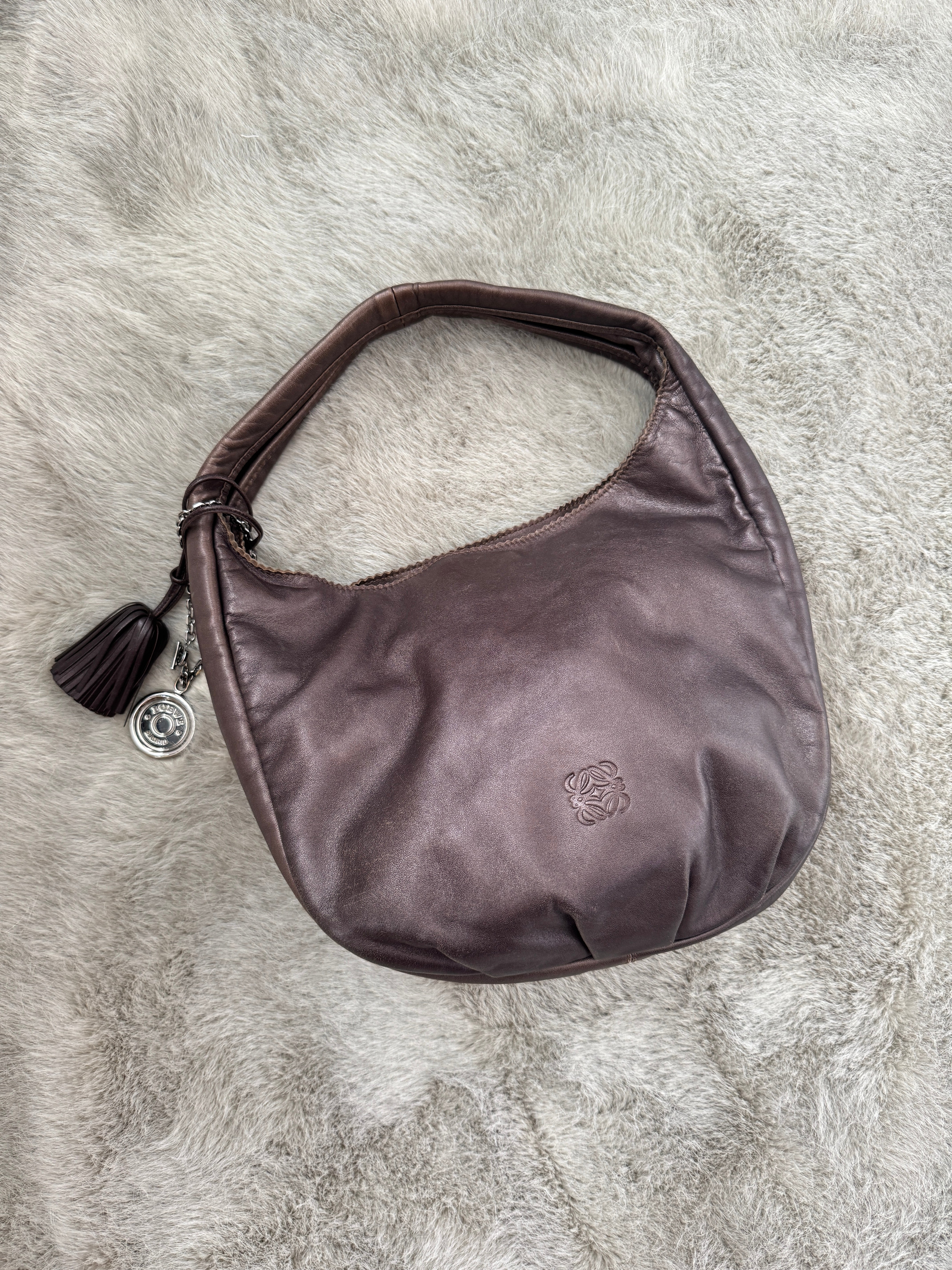 Viento Slouchy Shoulder Bag with Tassel and Charm in Brown Lambskin Leather
